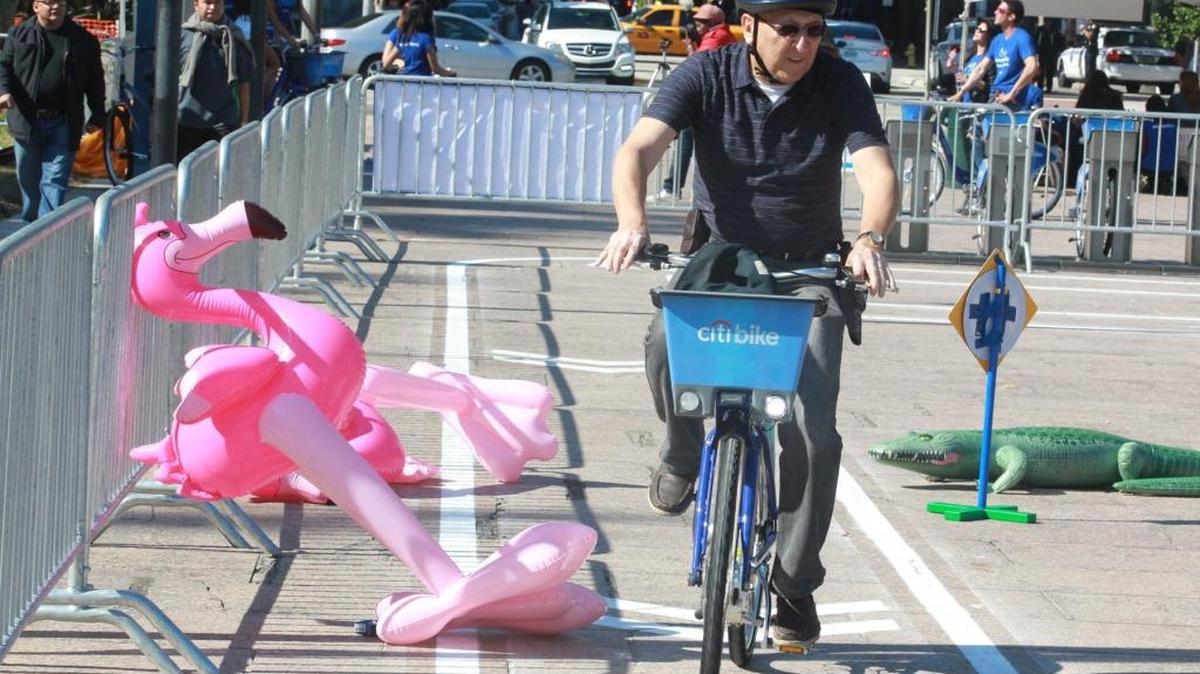 Carlos Fallon rides a Citi Bike in Bayfront Park in 2014. The bike-sharing program is administered by DecoBike.