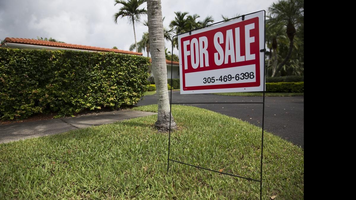 
A sign posted outside a home for sale on Southwest 112th Street in Pinecrest last month.
