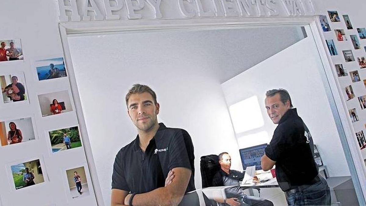 The Home61 management team, pictured in 2016: Olivier Grinda, left, Brian Paran and Olivier Brion inside their office that features photos of their happy clients.