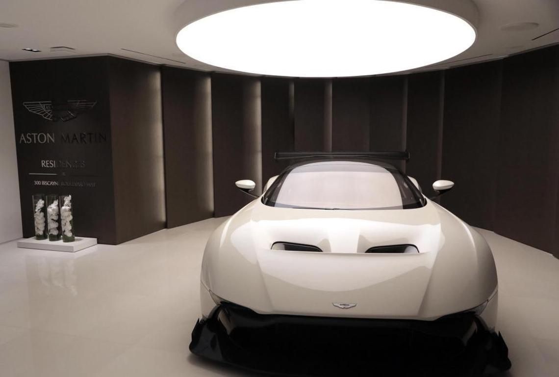 A $2.3 million Aston Martin Vulcan — one of only 24 in existence — greets guests at the three-story Austin Martin Residences sales senter in downtown Miami.