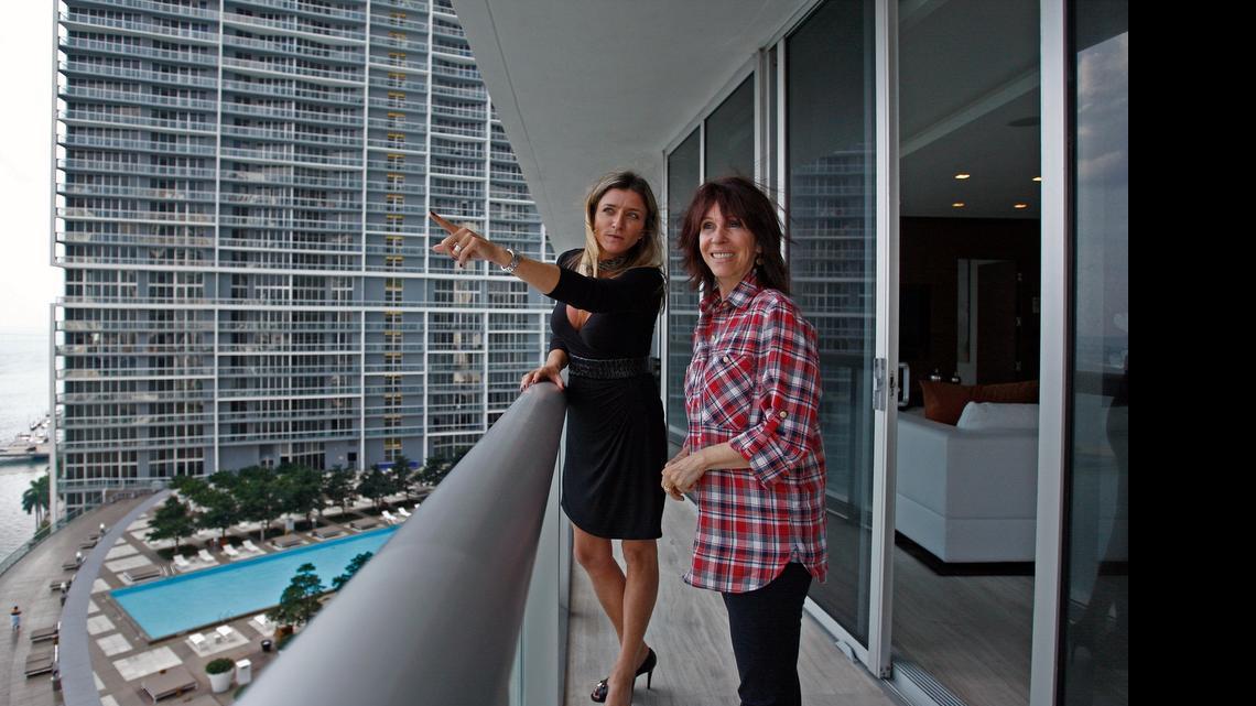
Real estate agent Fabiana Pimenta shows the Artefacto model apartment to Maria Helana Abreu of Brazil in 2011. Brazilians have been among the top investors in South Florida’s luxury condo market since the financial crisis ended.
