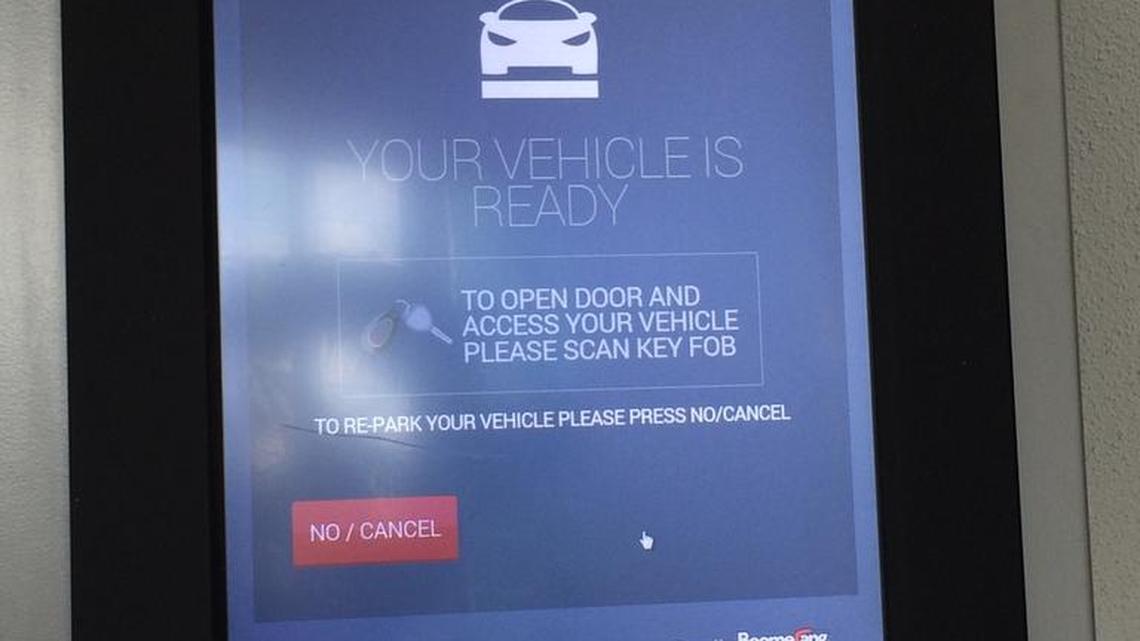 A hand-written note says that Brickell House’s robotic parking garage is shut down.