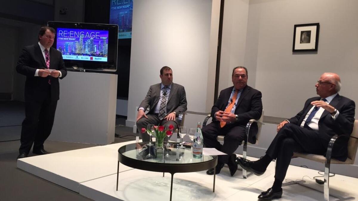 Real estate consultant Jonathan Miller, standing, leads a Miami Herald panel on South Florida real estate featuring Michael Stern of JDS Development, lawyer Neisen Kasdin of Akerman and Howard Lorber, chair of Douglas Elliman. The event, held Thursday in the New York galleries of Sothebys, drew about 140 to hear about the Miami market.