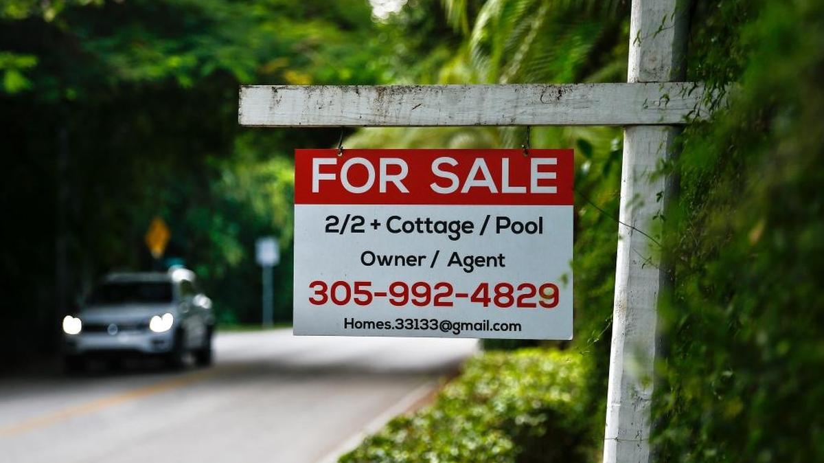 A "for sale" sign is displayed outside of a home in Miami on Saturday, Nov. 19, 2016.