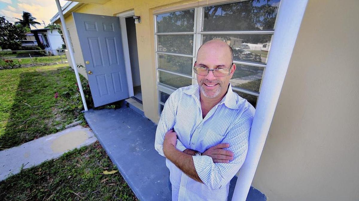 
Lex Levinrad in front of a house he flipped in Lauderhill.
