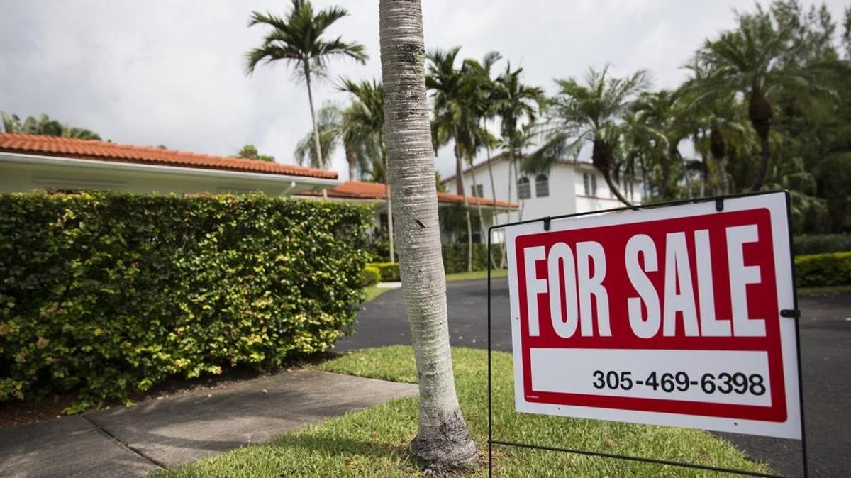 A sign posted outside a home for sale on Southwest 112th Street in Pinecrest last year.