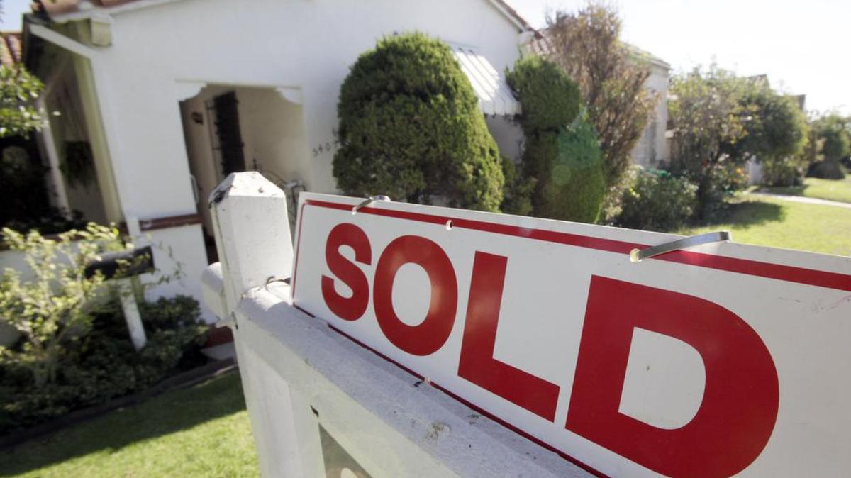 In this Nov. 17, 2009 photo, A "sold" sign is seen outside a home in Los Angeles. October home sales are up 10.1 percent, beating expectations, as tax credit spurs sales. (AP Photo/Reed Saxon)