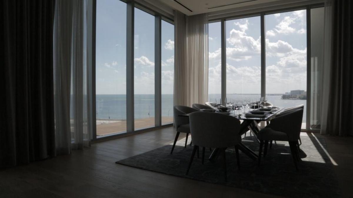 Developers of the upcoming luxury condo Una built a sales gallery on the 11th floor of the existing building at 175 SE 25th Road they purchased for $48 million. They acquired the building by buying each of the existing condos from their owners.