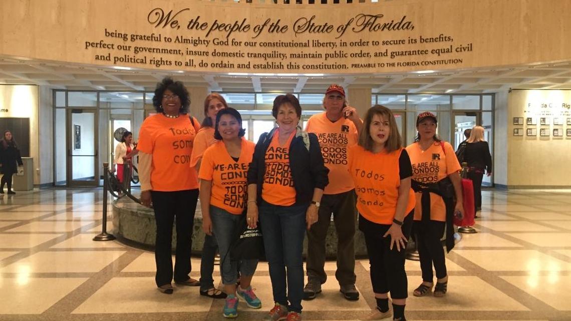 Condominium owners from Miami-Dade County pose in the Capitol in Tallahassee on Monday, May 1, 2017.