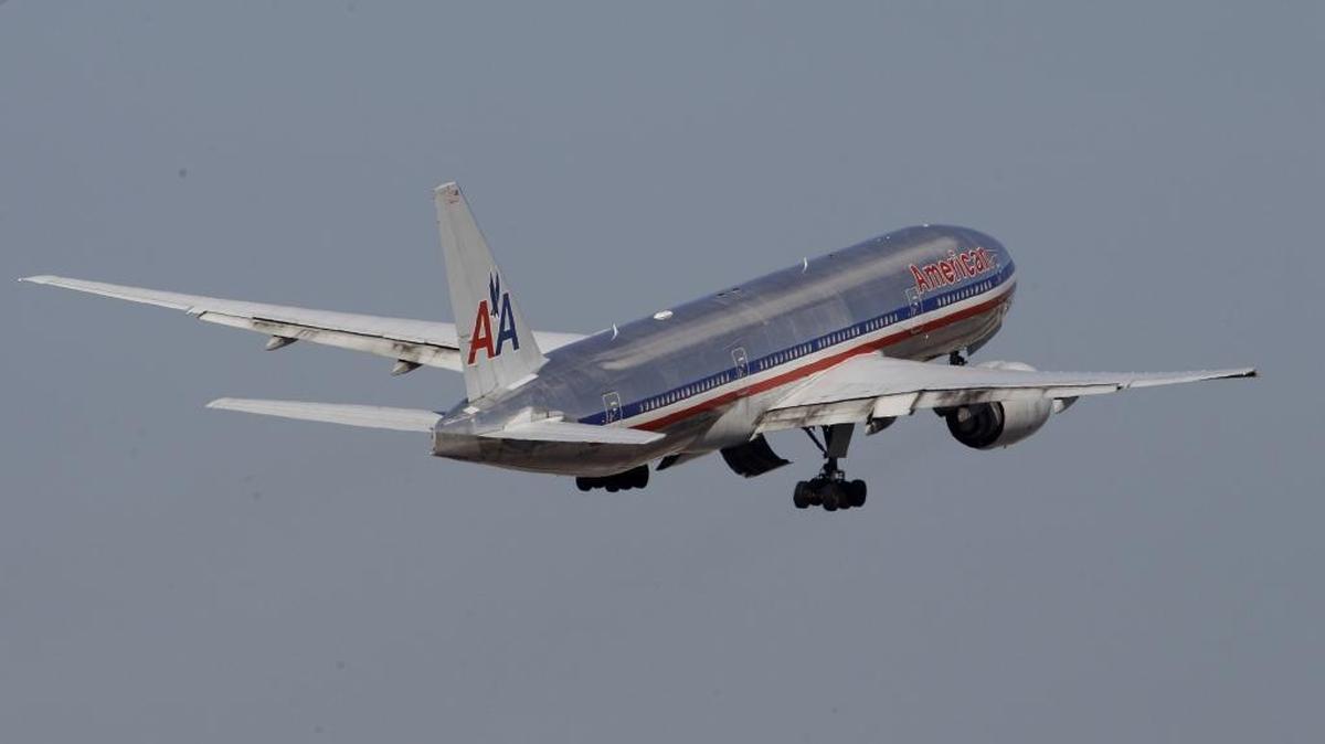 
An American Airlines airplane takes off at Miami International Airport 
