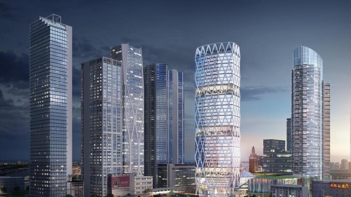 The illuminated building in white is an architectural rendering of the 45-story 110 NE 10th St. office tower, which will round out Miami Worldcenter’s mix of condos, rental apartments, retail, hotel and parks. Construction will begin in 2018.