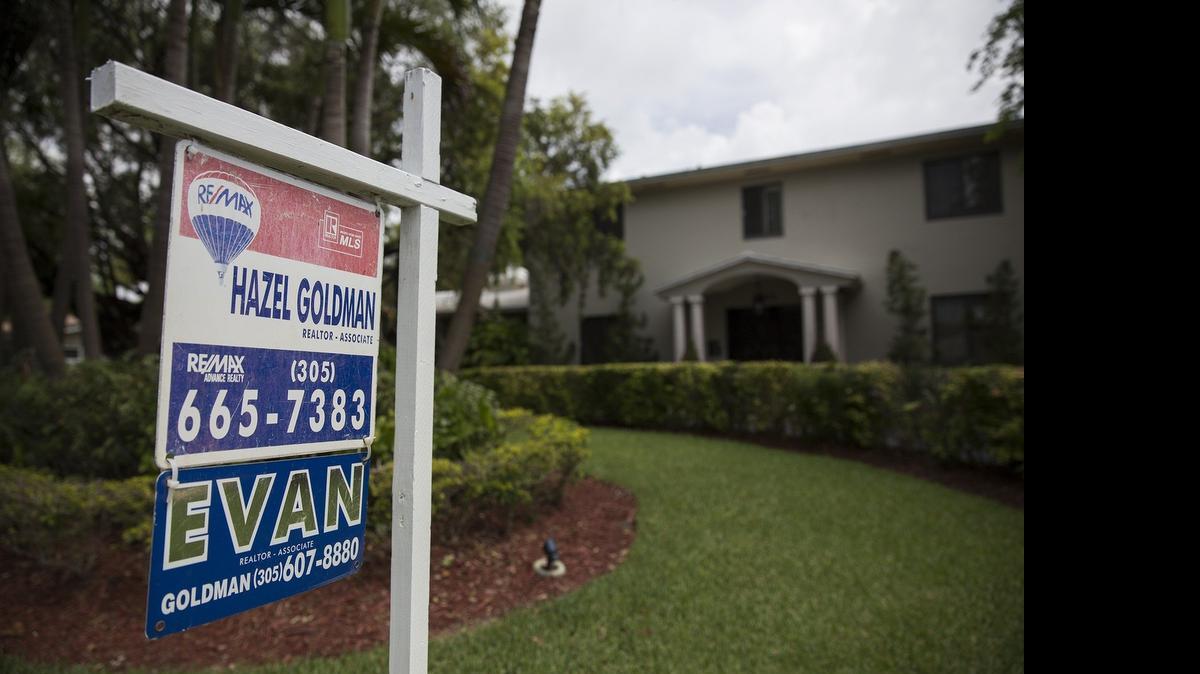 
A sign posted outside a home for sale on Southwest 115th Street in Pinecrest on Wednesday, June 10, 2015.
