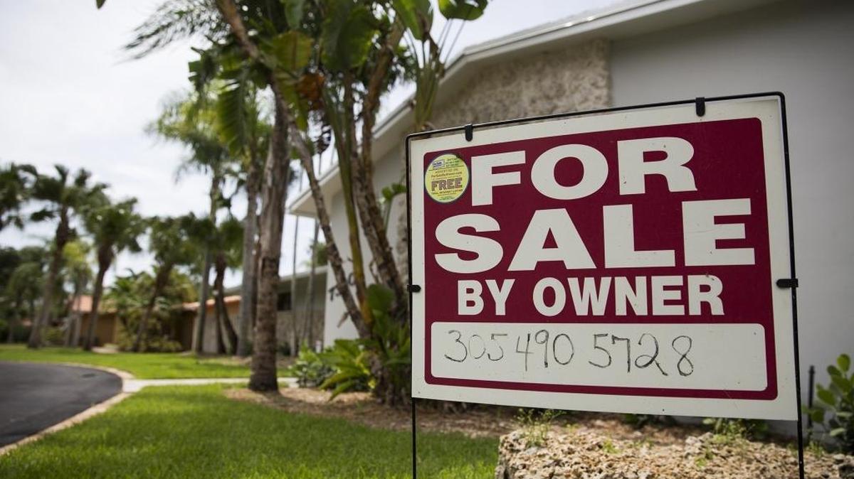 A sign posted outside a home for sale on Southwest 115th Street in Pinecrest last year.
