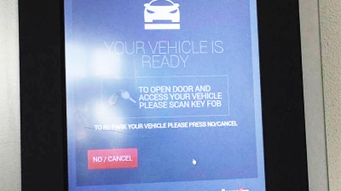 A hand-written note says that Brickell House’s robotic parking garage is shut down in this Nov. 2015 file photo.