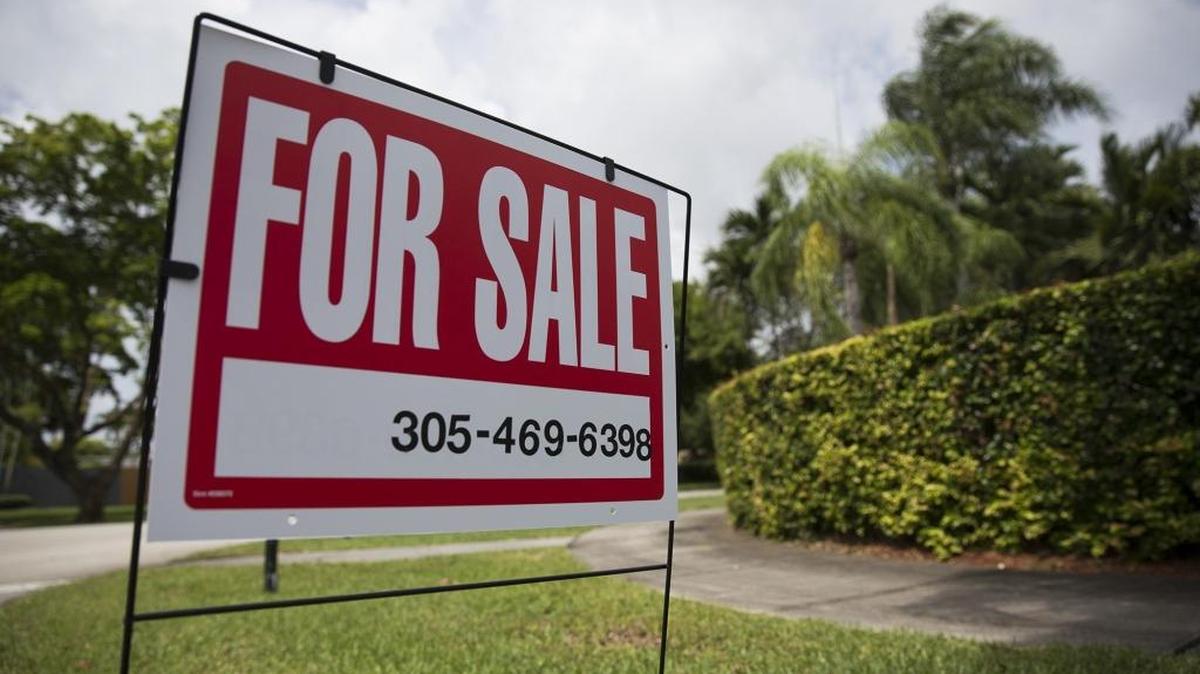 A sign posted outside a home for sale on Southwest 112th Street in Pinecrest in June.