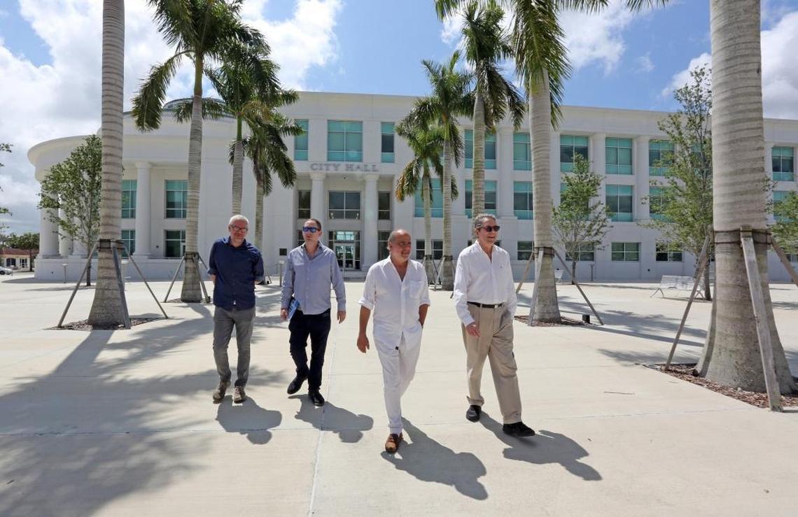 The architecture team from Rodriguez & Quiroga, from left, Christoph Goertz, Raul F. Rodriguez, Ivan Bibas and Raul L. Rodriguez walk the plaza in front of Homestead’s new city hall.