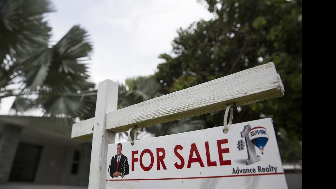 
A sign posted outside a home for sale on Southwest 73rd Avenue in Pinecrest on Wednesday, June 10, 2015.

