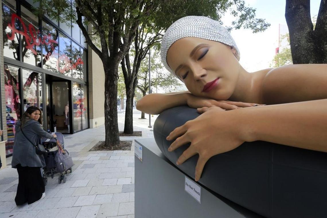 A hyperrealist sculpture titled "Survival of Serena" by artist Carole Feuerman is on display along the streets in the Miami Design District on Friday, Jan. 26, 2018.