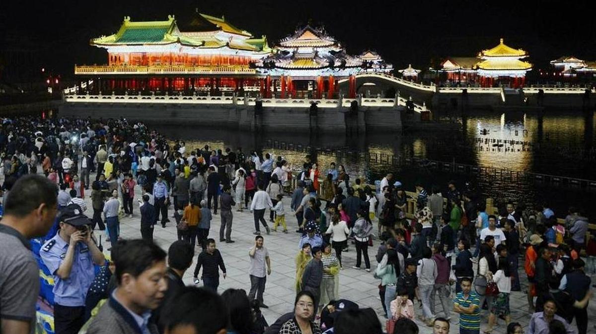 
In this photo taken May 9, 2015. visitors leave after a multimedia show at the New Yuanmingyuan, a newly-built replica of Beijing’s Old Summer Palace.
