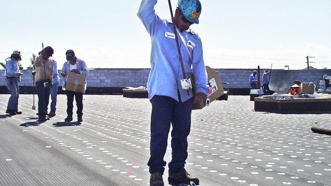 
A Latite employee works on a job site in Cutler Bay in this 1998 file photo.
