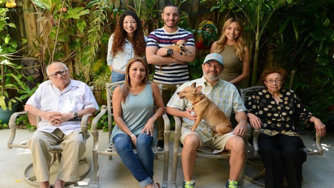 The Gutierrez family sits for a portrait on their back patio in Miami. Oswaldo Gutierrez and his parents bought a townouse between Sweetwater and Doral using a 30-year mortgage. He said they never could have afforded the home, where he now lives with his wife, parents and three children, without one. From front left: Jose Gutierrez, 89, Lucia Gutierrez, 51, Oswaldo Gutierrez, 53, and Daisy Gutierrez, 85. Oswaldo Gutierrez holds family dog Honey. From back left: Andrea Gutierrez, 23, Oswaldo A. Gutierrez, 26, and Kelly Gutierrez, 21. Oswaldo A. Gutierrez holds family dog Chiquita.
