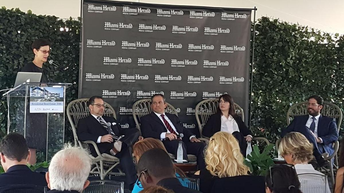 Realtor Jeff Morr, seated left, accountant Alan Lips, lawyer Meredith Singer and developer David Martin appear on a real estate panel Wednesday hosted by the Miami Herald at the sales center for 3900 Alton. Miami Herald Business Editor Jane Wooldridge moderated the event.