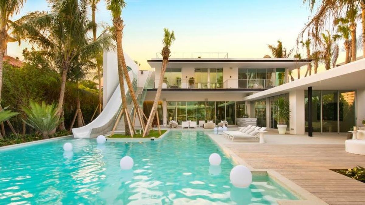 Slide right in. A six-bedroom mansion in Miami Beach sold for $22.5 million. It sports a 43-foot-long waterslide, too.