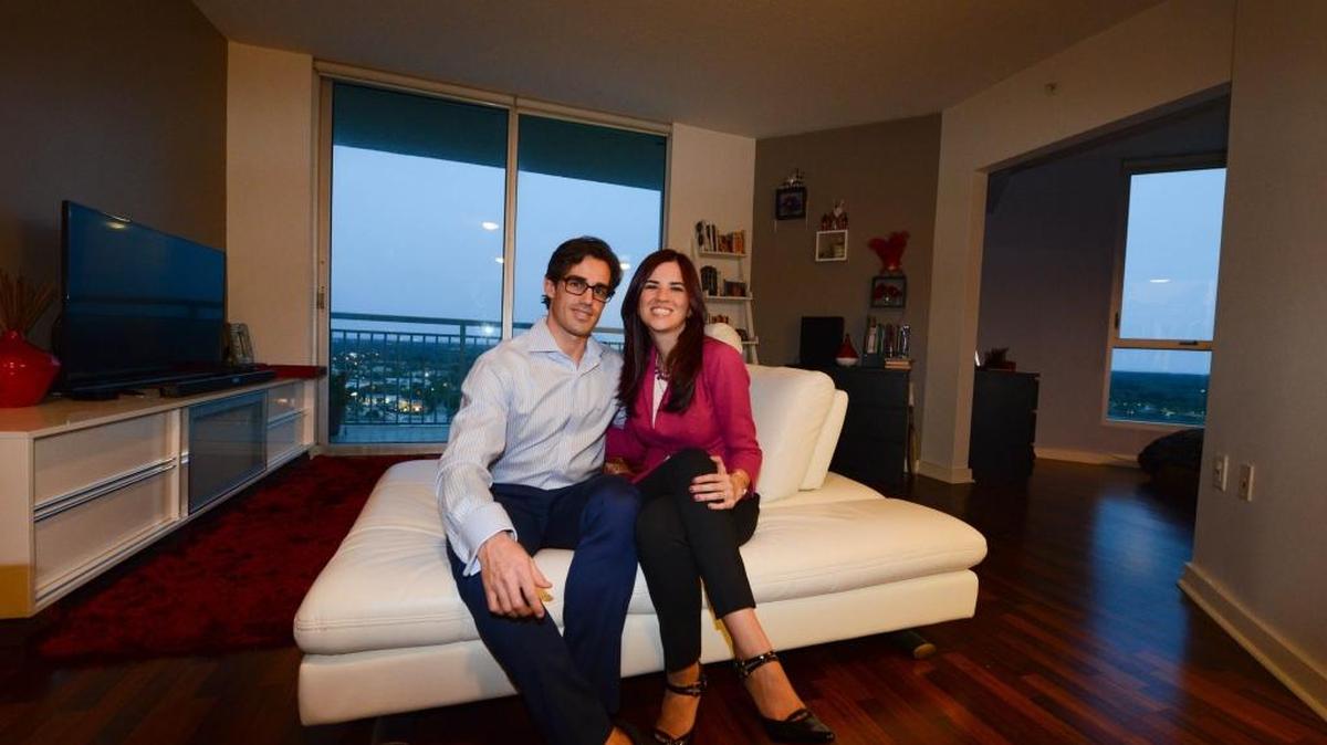 Jorge Padilla and his wife, Ana Amaya, pose for a portrait in their apartment in Miami. They have been renters, but with changes in their lives, now are preparing to buy a home.