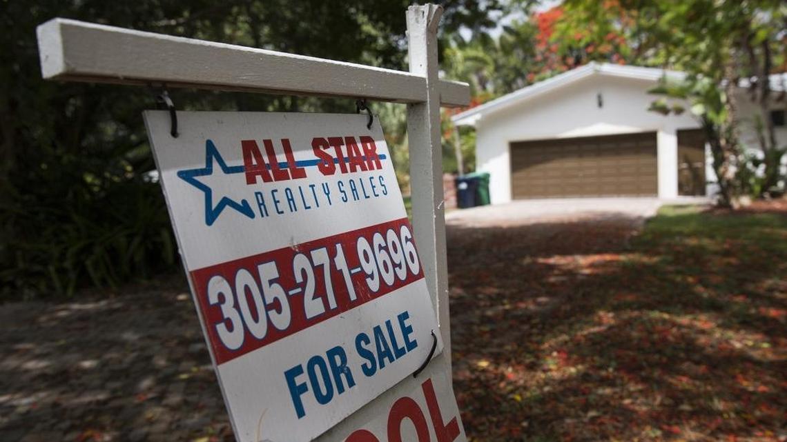 A sign posted outside a home for sale on Southwest 74th Avenue in Pinecrest.