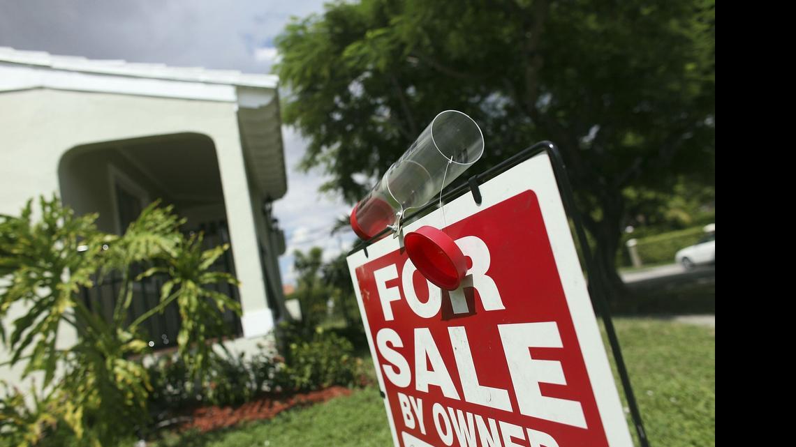 
A “for sale” sign is displayed outside a home in Miami in 2009. 
