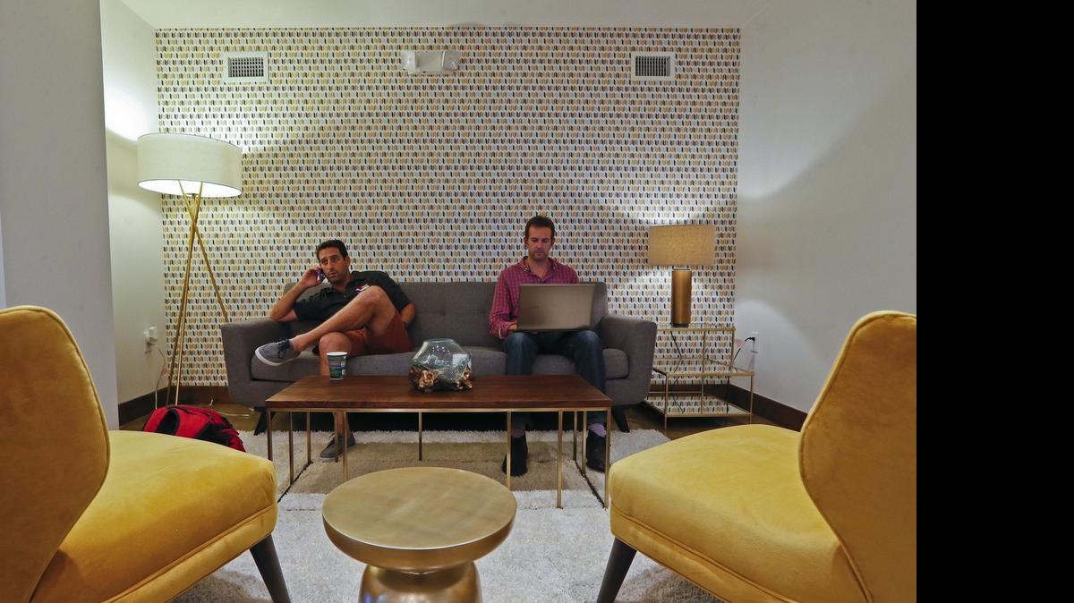 
Jonathan Strauss and Steven Quayle work at Buro MiMo, a new co-working space opening up in northeast Miami. Quayle of 3Floorsup is helping Strauss, who owns Skateboard Supercross, with some work on his digital platform. Buro MiMo has a retro-chic design to reflect its historic MiMo neighborhood of ‘50s architecture.
