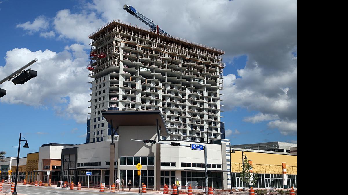 
A condo tower rises behind the new restaurants at Downtown Doral.
