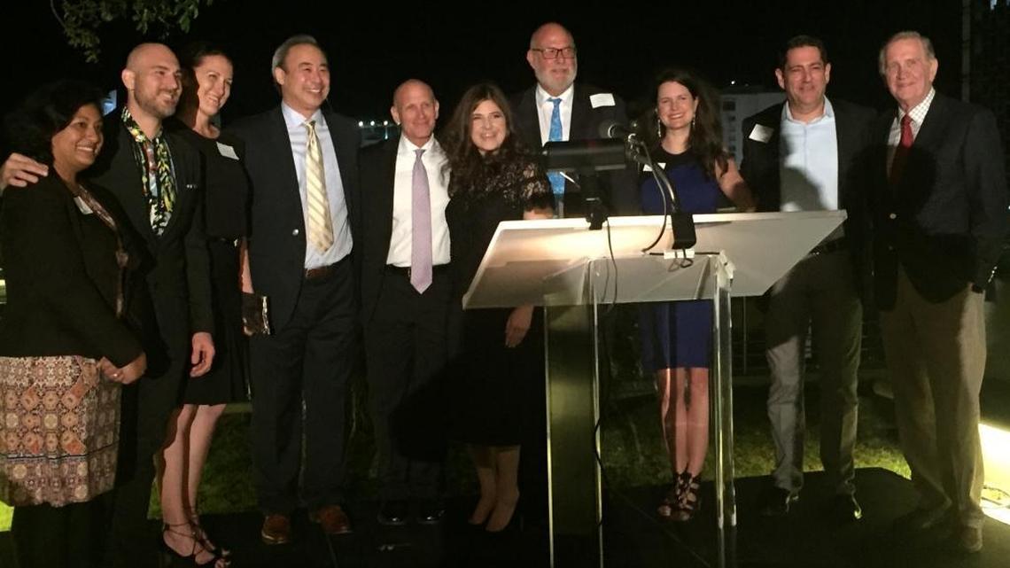 Lauren Harper (center), founder of Social Venture Partners Miami, introduces the organization’s founding partners at the launch event Thursday at New World Center. SVP Miami will support selected social impact ventures with capital, mentoring and connections.