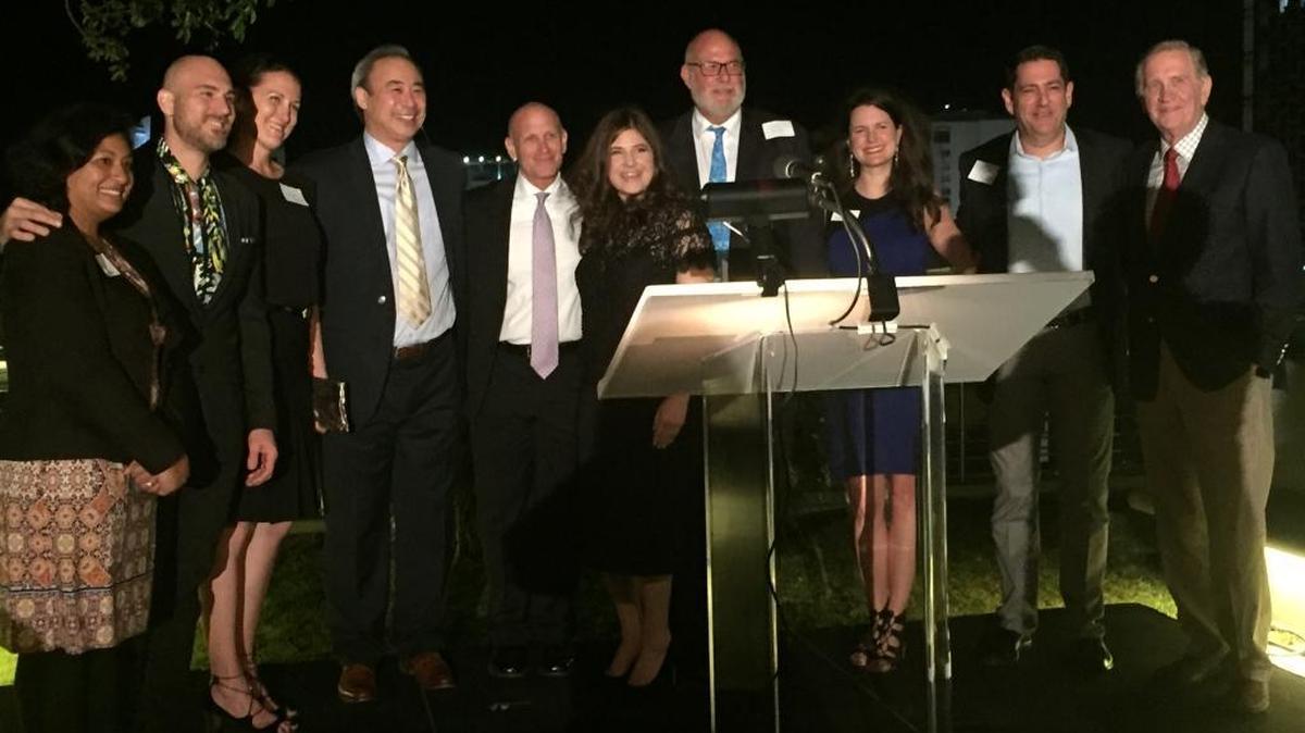 Lauren Harper (center), founder of Social Venture Partners Miami, introduces the organization’s founding partners at the launch event Thursday at New World Center. SVP Miami will support selected social impact ventures with capital, mentoring and connections.