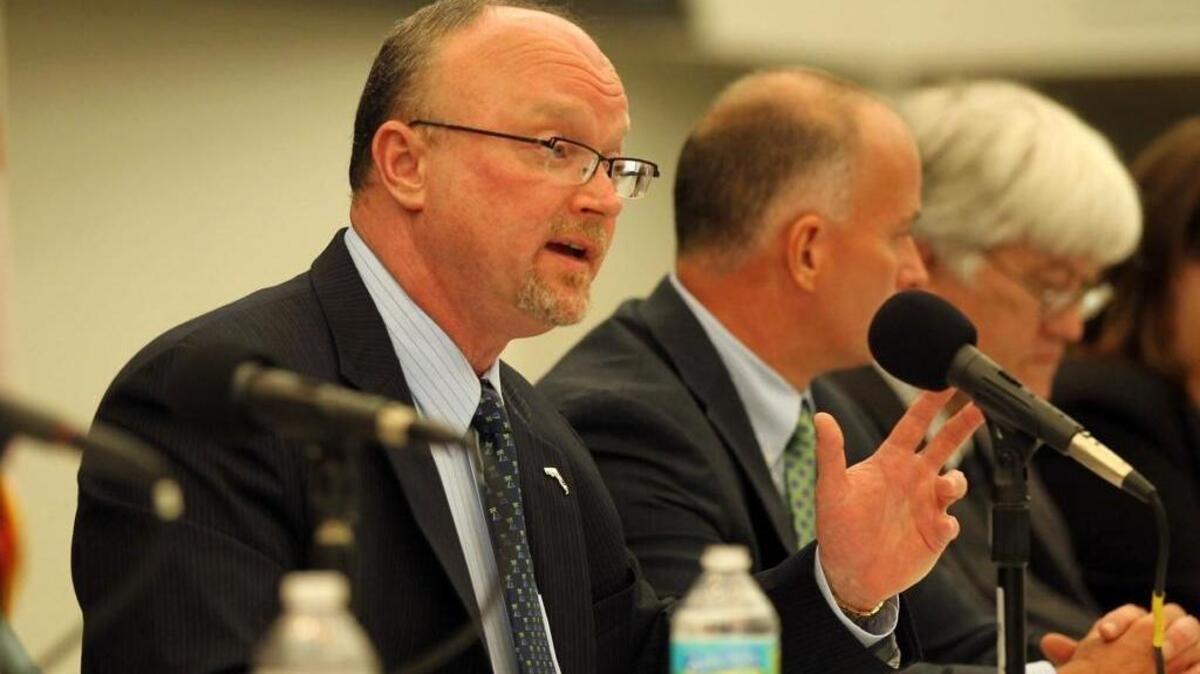 Kevin McCarty speaks at a public hearing for Citizens Property insurance rate increases, at the Miami Dade College Wolfson Campus, Sept. 20, 2012