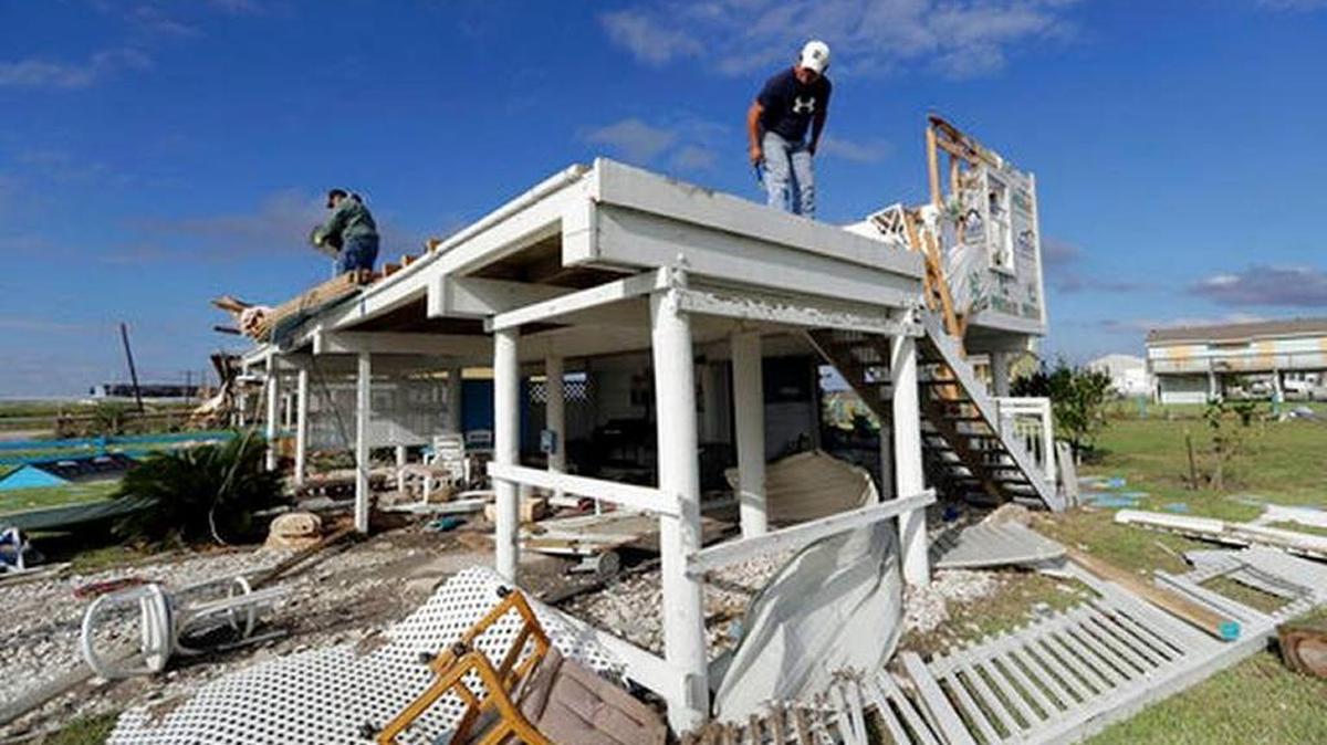 Joe Tijerina, right, works to salvage items from his home that was destroyed in the wake of Hurricane Harvey, Tuesday, Aug. 29, 2017, in Rockport, Texas. Eric Gay AP Photo