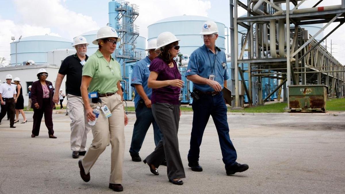 Hilda Solis, then the U.S. Secretary of Labor, tours the FPL plant in Dania Beach in 2011. Solis, center, is escorted by FPL executives and employees.