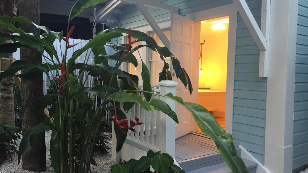 The Roam bedrooms at River Inn Miami are located in houses that also have communal porches, a kitchen and living and co-working areas.
