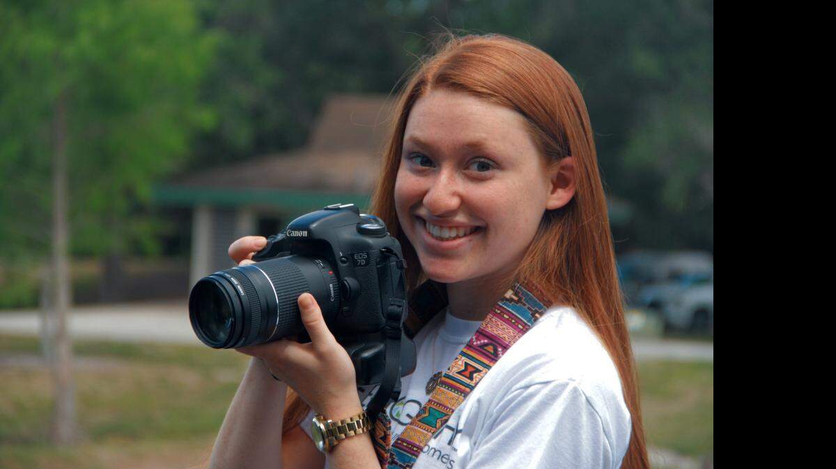 
University School student Katelyn Barclay, who started her photo business Teenography as a sophomore, takes pictures at Tree Tops Park in Davie in March.
