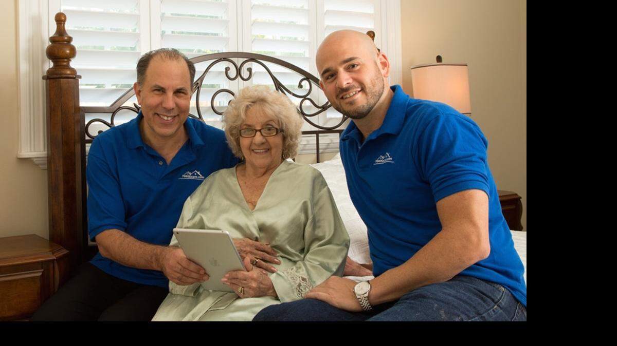 
CHALLENGE CHAMPION: Room2Care founders Todd Florin, left, and Richard Ashenoff, right, launched a cost-sharing senior home-care service. Edith Leake is one of their customers.
