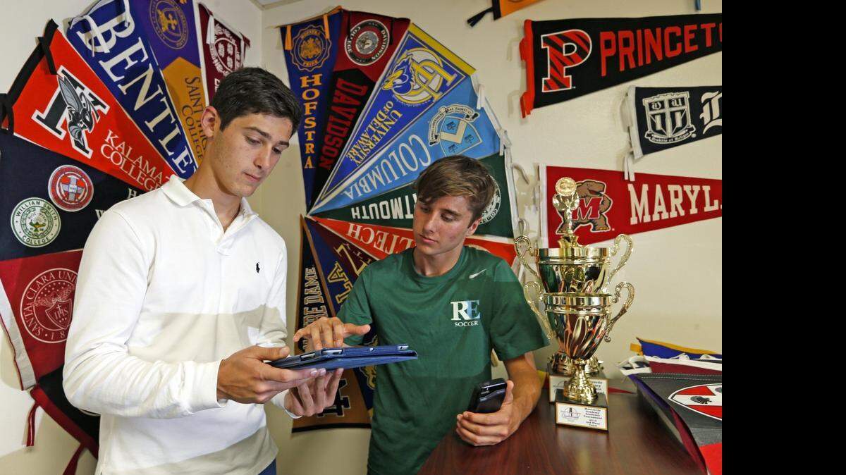 
Ransom Everglades seniors Eduardo Garcia-Montes, left, and Wesley Villano dreamed up an app called MyScholarship, which would help students navigate the college application process.
