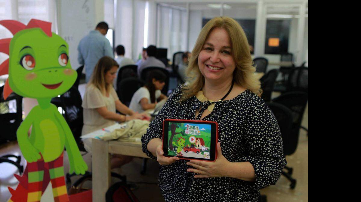 
CHARACTER GOES DIGITAL: Tania Gilinski created Juana la Iguana years ago, but now, in its sequel, she and other founders are using Juana in a series of apps to teach young kids values, Spanish vocabulary and Latin culture. Here Gilinski is shown at Rokk3r Labs in Miami Beach.
