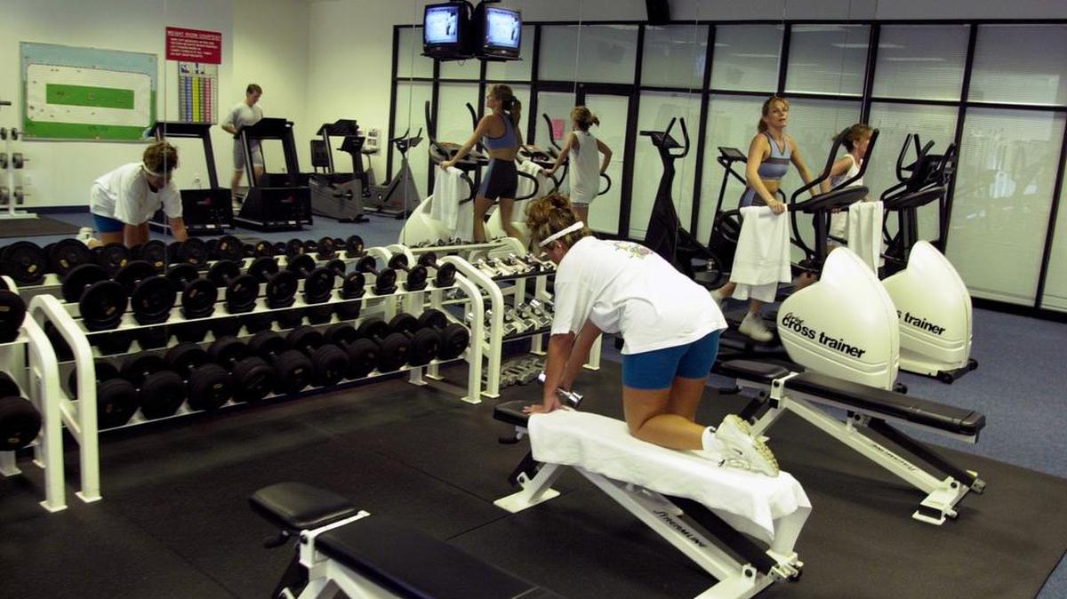 
 JM Family Enterprise employees work out in the company gym.
