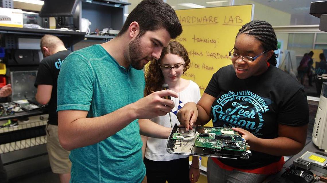 
From left, John Aguilar, Kelly O’Connell, Renee Brown work in a hardware laboratory in Florida International University’s new Tech Station at its main campus in west Miami-Dade County. The $3 million center will serve as a hub for student innovation and preparation for technology jobs.
