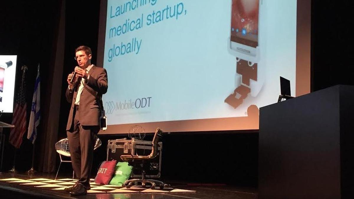 Ariel Beery, CEO of MobileODT, shows a portable cancer screening system, field-tested in Haiti and other developing nations.