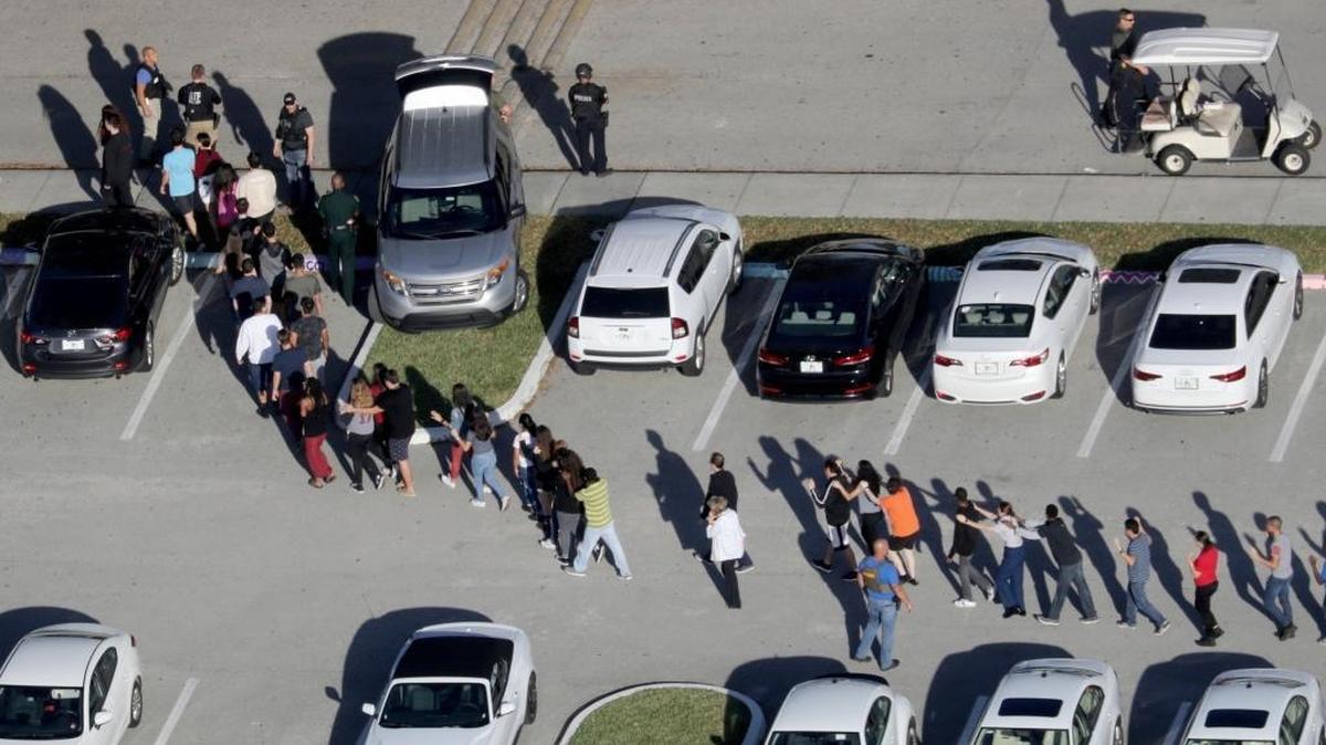 Students are evacuated by police from Marjory Stoneman Douglas High School in Parkland after a shooter opened fire on the campus. Online trolls and bots, many of which experts have tied to Russia’s campaign to spread disinformation on American social media, are capitalizing on breaking news such as the shooting.