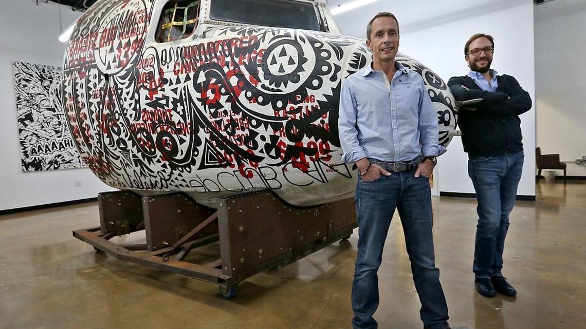 Yellow Pepper CEO and Co-Founder Serge Elkiner (at right) with investor Marko Dimitrijevic at the YellowPepper office in Wynwood. The art piece shown is a cockpit of a DC3.