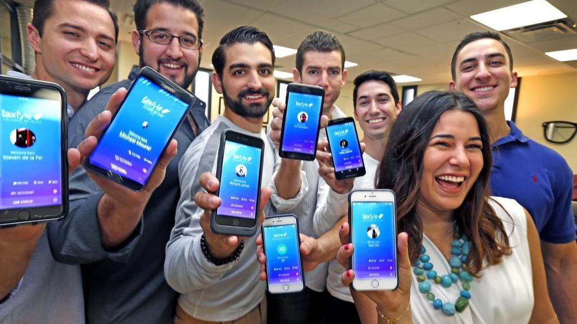 Taxfyle team members Steven de la Fe, Michael Mouriz, Richard Lavina, Will Sahatdjian, Phillip Ingelmo, Martha Rodriguez and Antonio Del Cueto display Taxfyle’s app. Taxfyle provides CPA on-demand service through its iPhone and Android apps; users are matched with a CPA to prepare and file their tax returns.