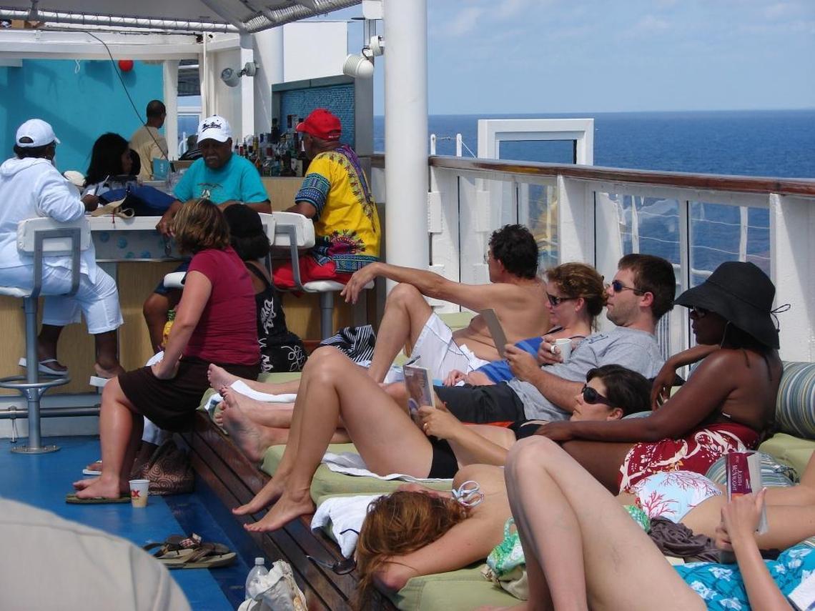 In this Miami Herald file photo, passengers are seen sunning poolside on the Grand Celebration in 2009.