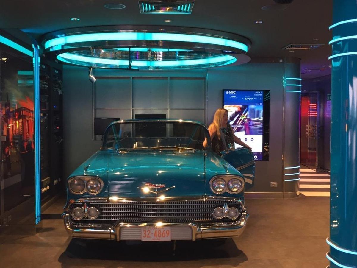 A turquoise Chevy Bellaire has been converted into a DJ booth aboard the MSC Seaside.